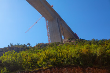 construction of a bridge , industrial crane 