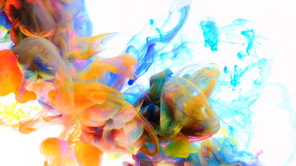 Fototapeta na wymiar Color drops in water , abstract color mix , drop of Ink color mix paint falling on water Colorful ink in water