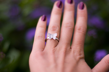wedding rings on hands of groom and bride
