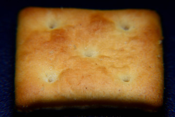 Close up of cracker with black background