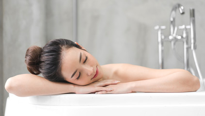 Obraz na płótnie Canvas Portrait of smiling of happy beautiful pretty asian woman clean fresh healthy white skin enjoy relaxing taking shower and bath with in bathtub at the bathroom