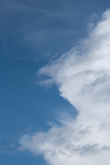 Puffy white clouds on a blue-sky day, as a nature background