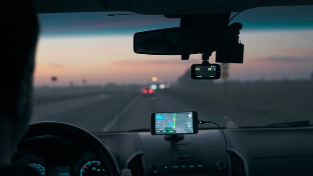 Navigator in a car while driving in the morning
