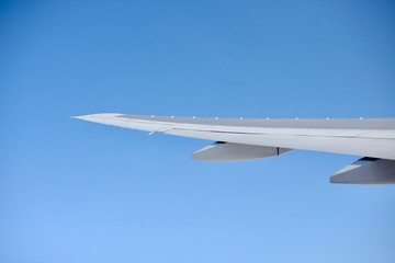 Fototapeta na wymiar airplane in the blue sky