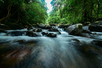 The water that flows down from the mountain through rocks in Khao Chamao Waterfall Rayong,...