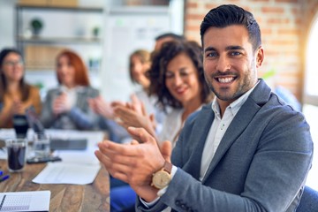 Group of business workers smiling happy and confident. Working together with smile on face looking...