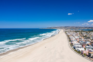 Aerial drone photo of a completely empty Mission Beach due to the Coronavirus and Covid 19 Pandemic. San Diego, Ca, USA.