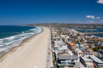 Fototapeta na wymiar Aerial drone photo of a completely empty Mission Beach due to the Coronavirus and Covid 19 Pandemic. San Diego, Ca, USA.