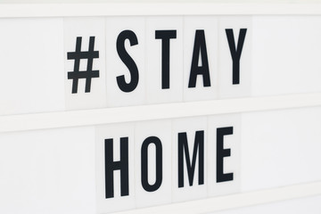 Stay Home written in a lightbox text. Coronavirus concept. Quarantine and isolation. Novel coronavirus. (2019-nCoV). Covid-19.