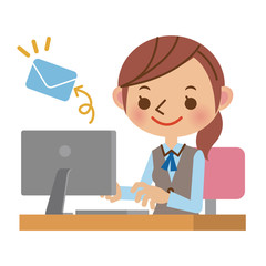 パソコンでメールを送るOL・事務職の女性
