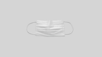 White protective medical mask on gray background. Banner of flu coronavirus Covid-19 and quarantine concept. Stock photo.