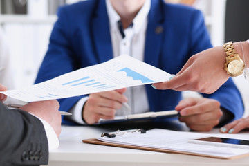 Group of people discuss financial results at workplace closeup. Training course mediation offer income profit review finance investment loan audit secretary job desk talk pad arm concept