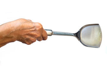Senior woman's right hand holding Stainless spade of frying pan on white background, Close up shot, Selective focus, Kitchen utensils concept