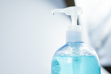 Close up hand sanitizer gel pump bottle, alcohol gel for prevention coronavirus disesse 2019 (COVID-19), bacteria and germ with copy space, health care concept