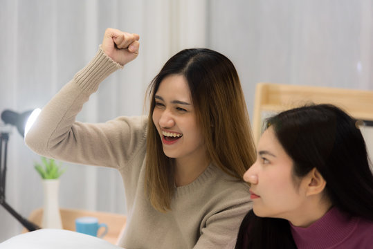 Young Beautiful Asian Woman Lgbt Couple Playing Console Game Together Fight For Winner With Joy And Serious Mood On Bed In Bedroom At Night Time