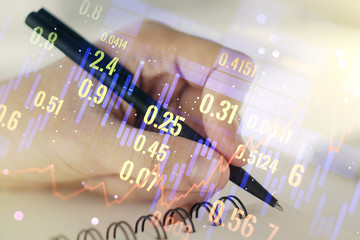 Multi exposure of abstract financial diagram with hand writing in notepad on background, banking and accounting concept