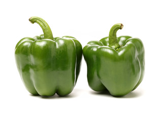 fresh green bell pepper (capsicum) on a white background