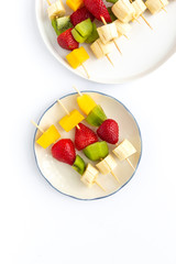 Healthy assorted fruit skewers from above