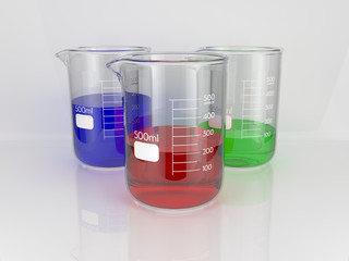 Three glass chemistry beakers with three coloured liquids