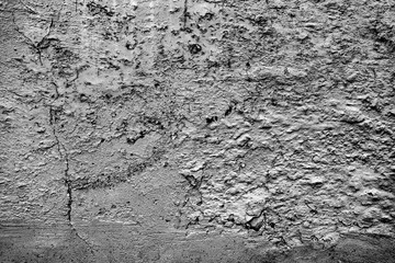 Texture of a concrete wall with cracks and scratches which can be used as a background