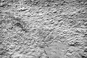 Texture of a concrete wall with cracks and scratches which can be used as a background