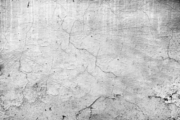 Texture of a concrete wall with cracks and scratches which can be used as a background