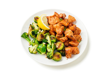 Roasted chicken meat and grilled vegetables isolated on white background