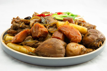 Korean chicken stew with soy sauce, glass noodle, rice cake and vegetables