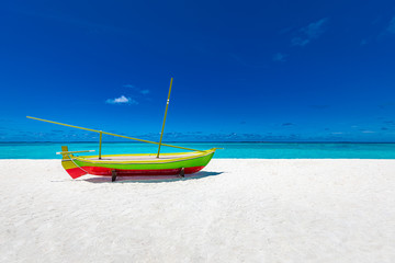 Obraz premium Traditional wooden fishing boat on the beach. Travel landscape, beach decoration