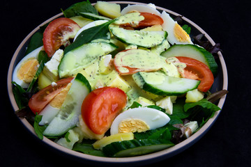 Egg, Feta, and some vegetable salad like cucumber, tomato and potato
