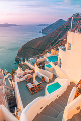 Oia village in the morning or sunset light, Santorini, Greece. Beautiful summer travel and vacation landscape