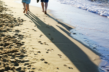 barefoot people on a beach