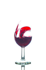 glass splash red wine with white background celebration