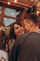 Fototapeta premium a young couple embraces in the street