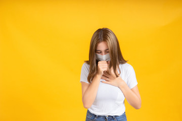 Coronavirus covid 19 mask protects filter of Young asian woman cough infection her is sick and cold unhealthy on yellow background, illness safety with mask protective concept