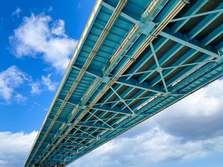 Underside of girder of steel bridge.