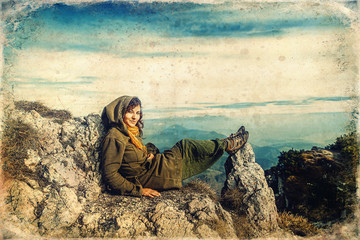 woman relax in the mountains after a long hike, old photo effect.