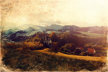 View of ruin castle in beutiful landscape, old photo effect.