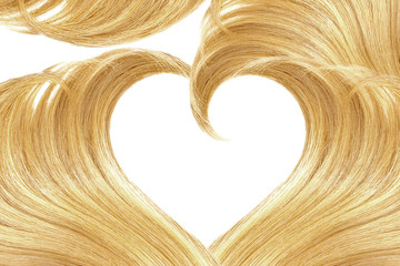 Blonde hair in shape of heart, isolated on white background