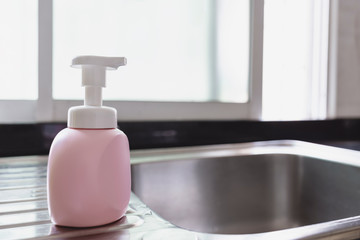 Fototapeta na wymiar Anti bacteria soap on sink in the kitchen