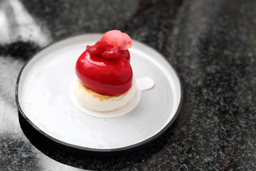 Sweet dessert with chocolate glaze. Appetizing, sweet dessert. Colorful cream cakes.