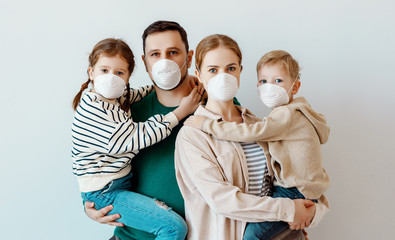 Family in medical masks during disease outbreak.
