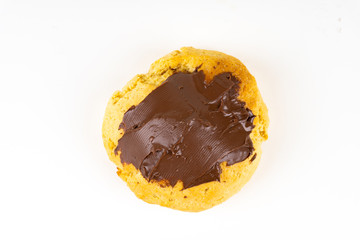 A cookie cake with chocolate on white background with copy space