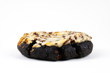 A cookie cake with chocolate on white background with copy space