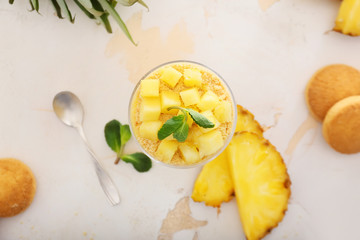 Glass with tasty panna cotta on white background