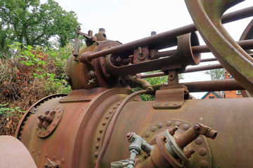 A close up view of the working parts of an old traction engine