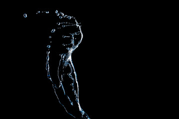 Splash of clean water on dark background