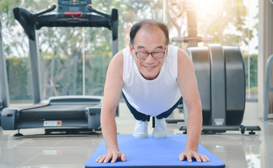 senior asian man exercise  workout at sport gym. elderly healthy man lifestyle at gym club. senior sport training.