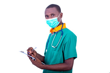 young male doctor writing notes on clipboard.