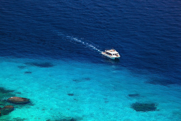 one motorboat in beautiful blue lagoon of Similan islands